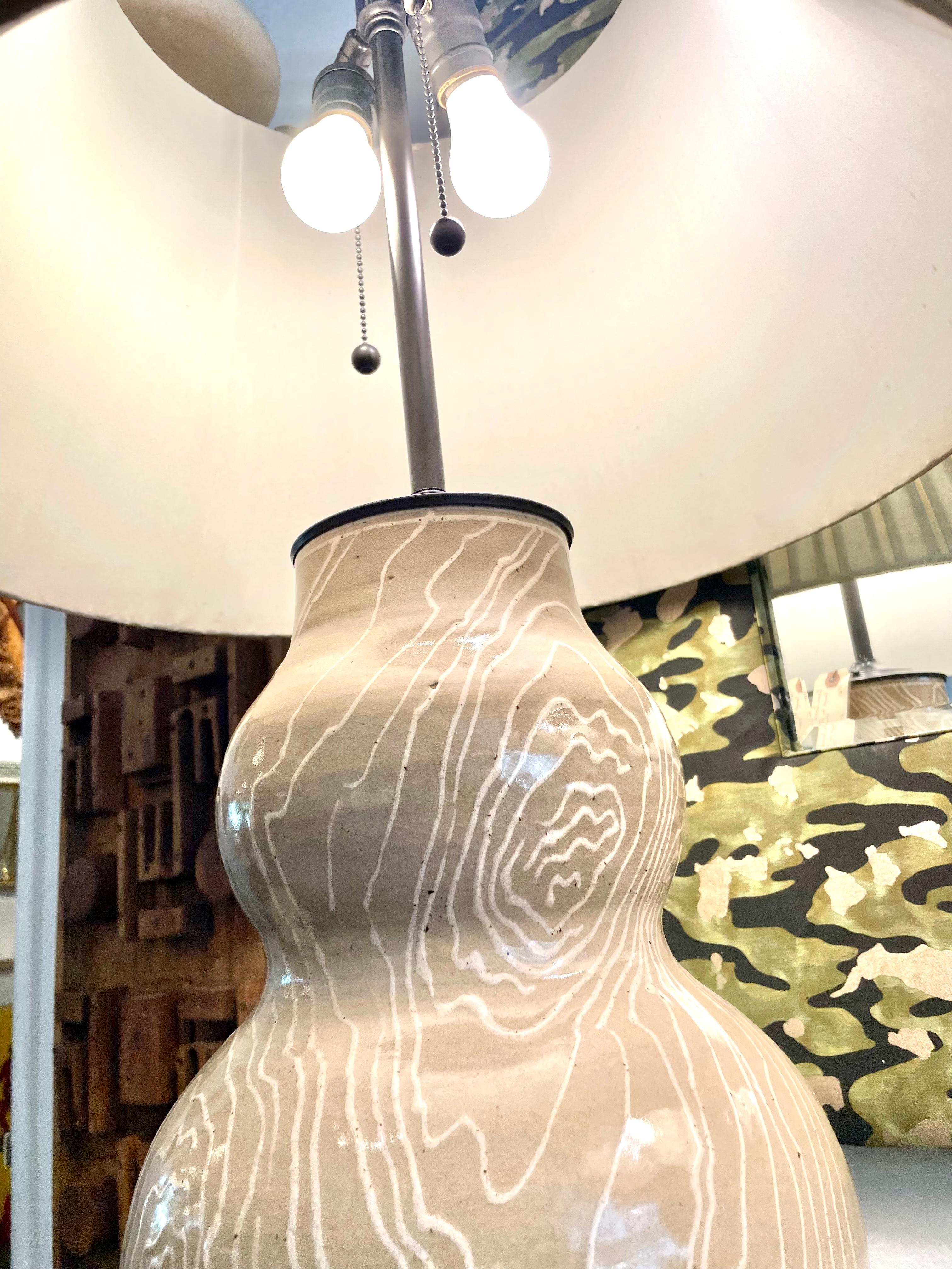 These wonderful organic ceramic lamps by famed pottery artist, Roy Hamilton, are in beige tone with tree trunk rings design - very clean and elegant. Bronze tone base and stem - double cluster sockets, newly rewired. Shades shown are NOT included