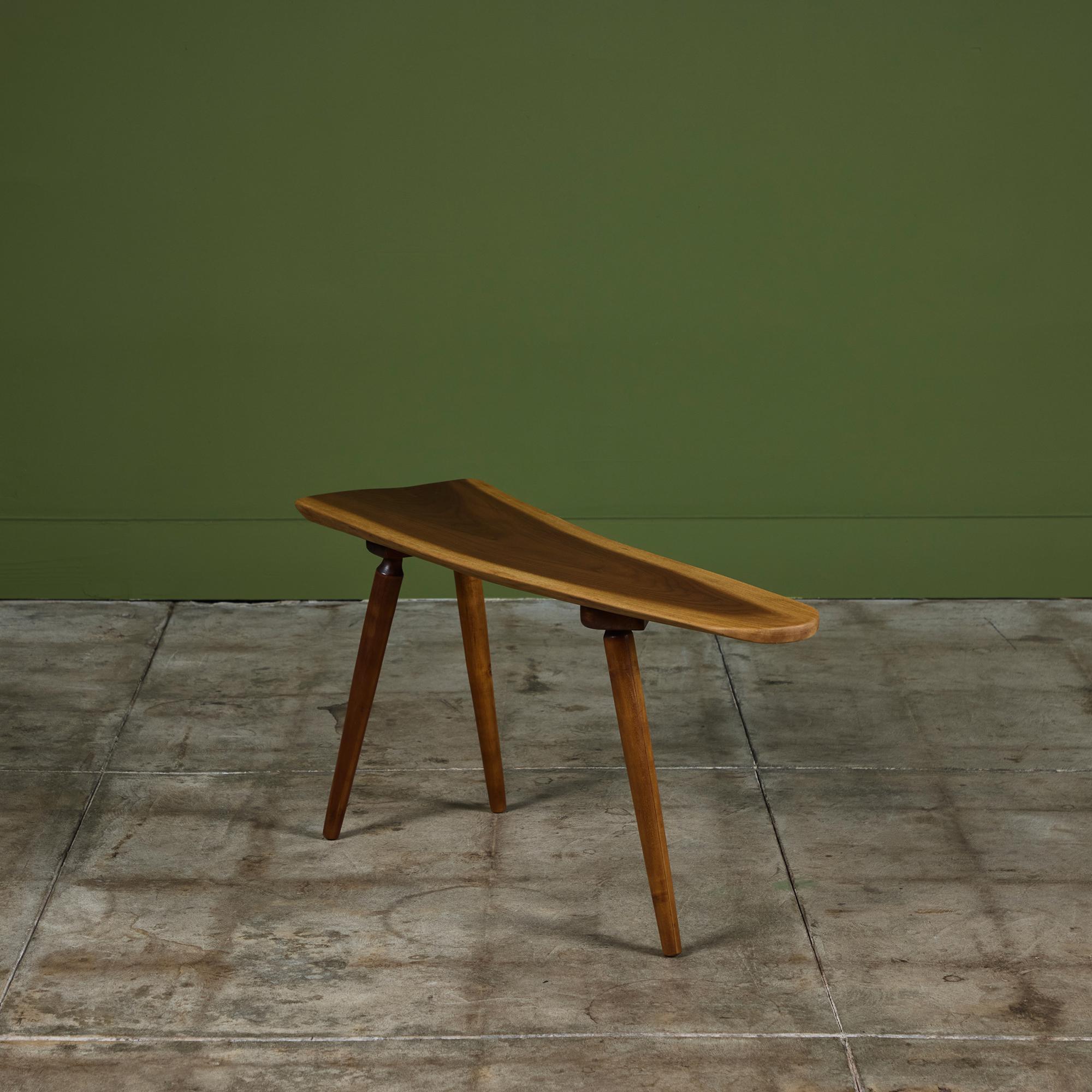 Free edge walnut side table that tapers toward one side on three tapered splayed legs, was made from the trees Roy Sheldon harvested from his property and sold from his front yard in Marlborough, Vermont.  
Signed 