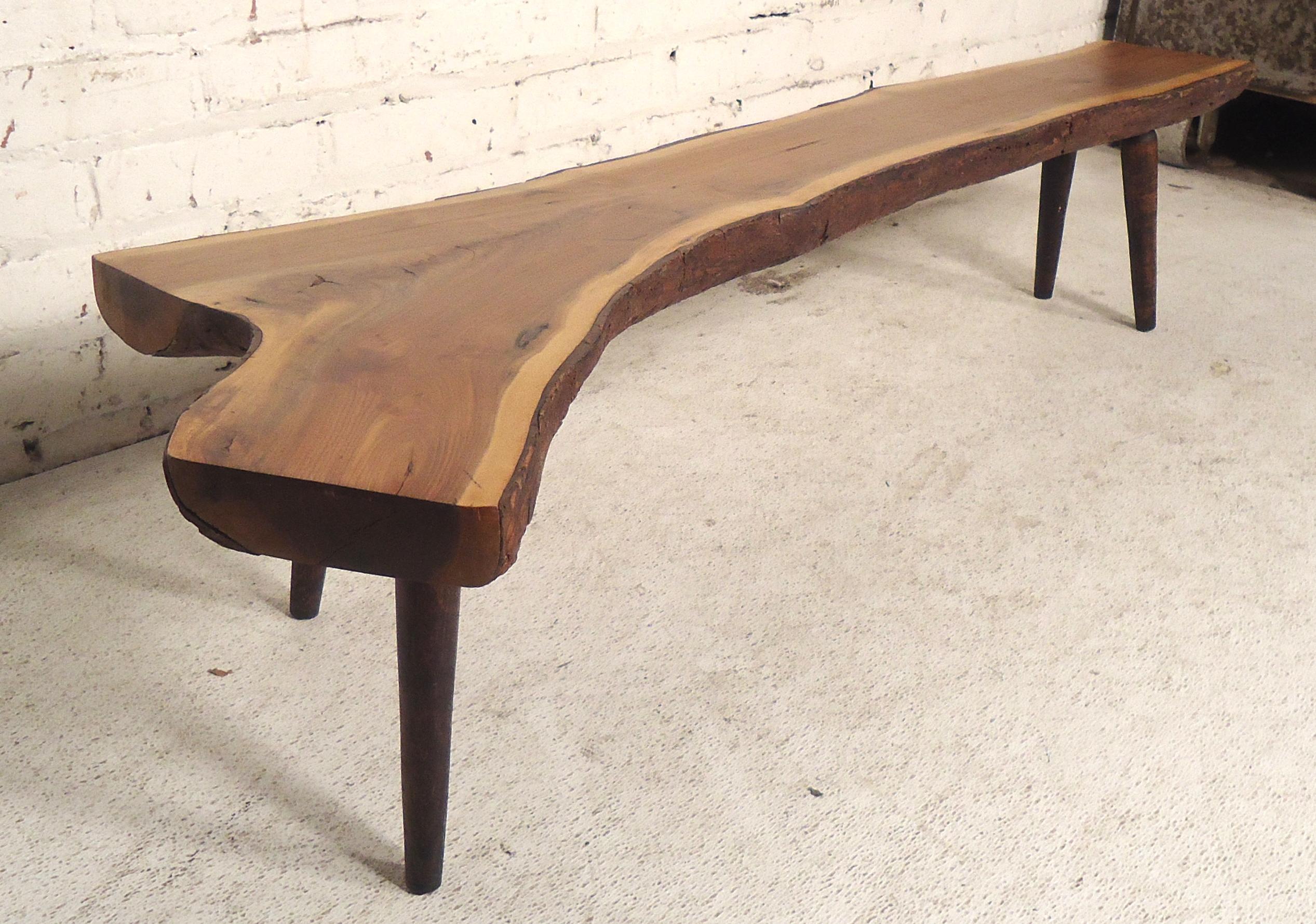 One of a kind live edge table/bench by Vermont artist Roy Sheldon. Sourced wood from his property and gifted with personal note and signature underneath.
(Please confirm item location - NY or NJ - with dealer).
 
