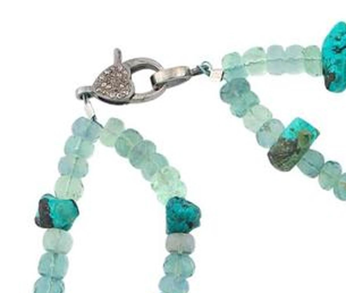 This handmade double strand of beautifully glowing multi-colors of Brasilian fluorite is decorated with gemmy chunks of Royal Blue Turquoise each enhancing the other in this unique necklace..
Size:  Fluorite 6 mm ;  Length:  17 inches;  Clasp:  tiny