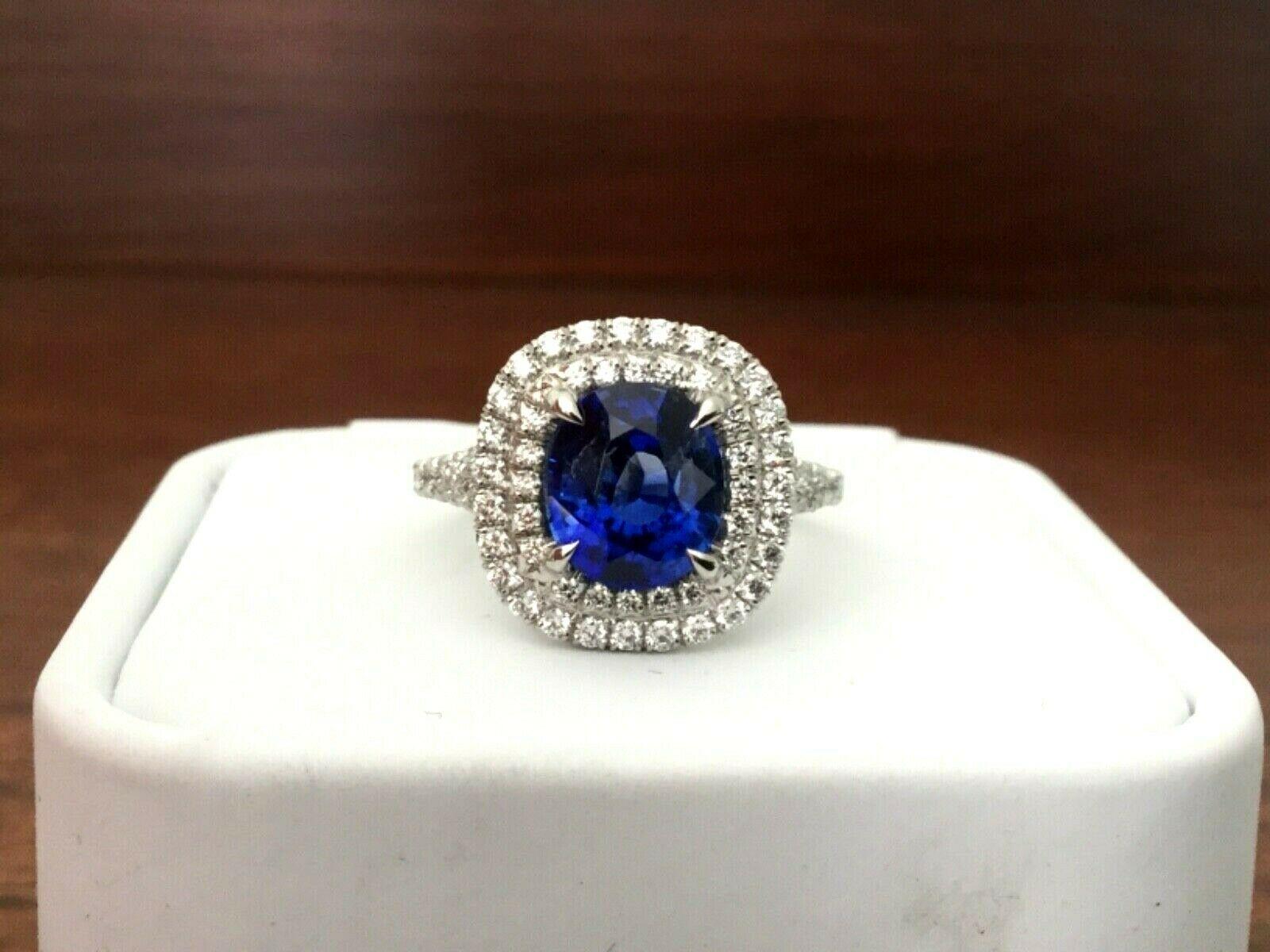 For your consideration is a 2.68 carat OVAL cut, natural, deep royal blue sapphire set in a brand new platinum double halo setting with .63 carats of natural G color VS clarity white diamonds.  The sapphire is GIA certified and has been beryllium
