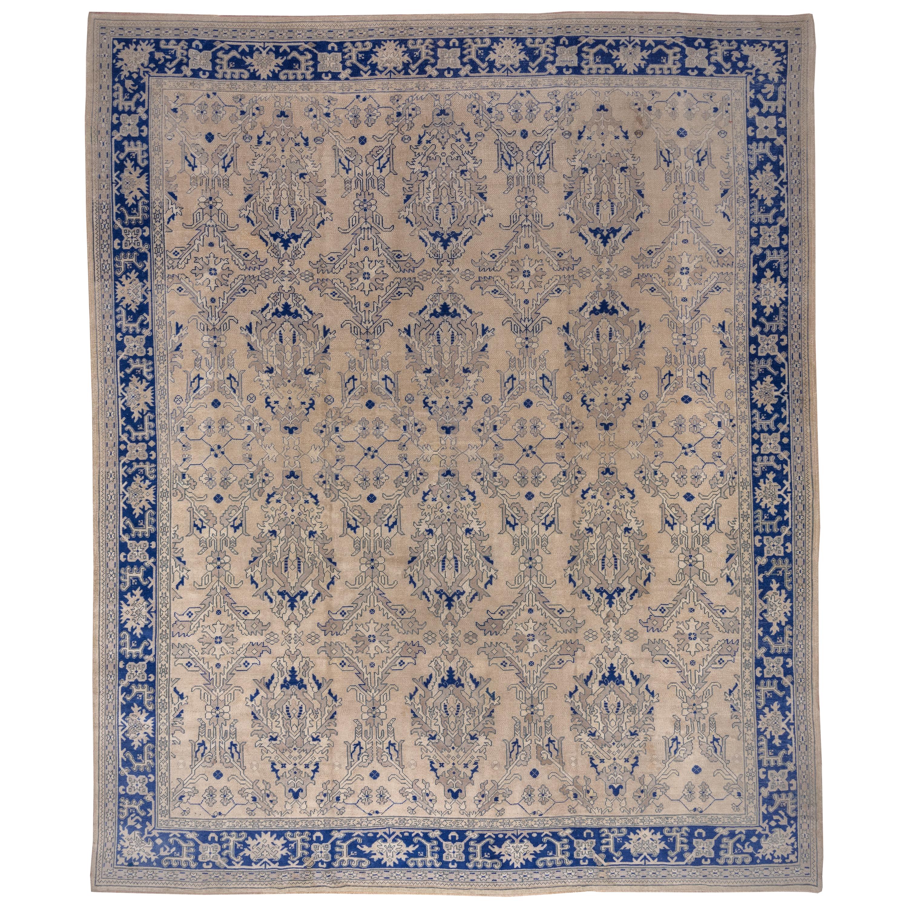 Royal Blue Bordered Antique Oushak Carpet For Sale