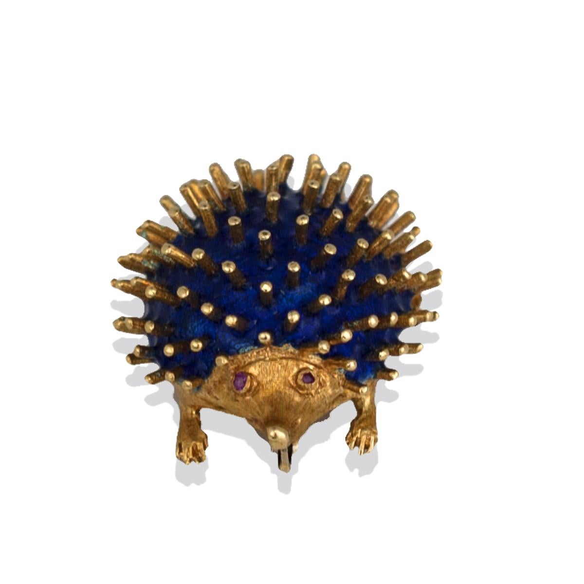 Royal Blue Enameled, Hedgehog Ruby Pin, Hallmarked, CG, 750 Gold 
Mid-Century Pin features 1-1/2 inch in length by 1 inch wide, pin of quality workmanship Hallmarked CG, 750 
Detailed eyes of bezel set rubies, feet with detail and white gold locking
