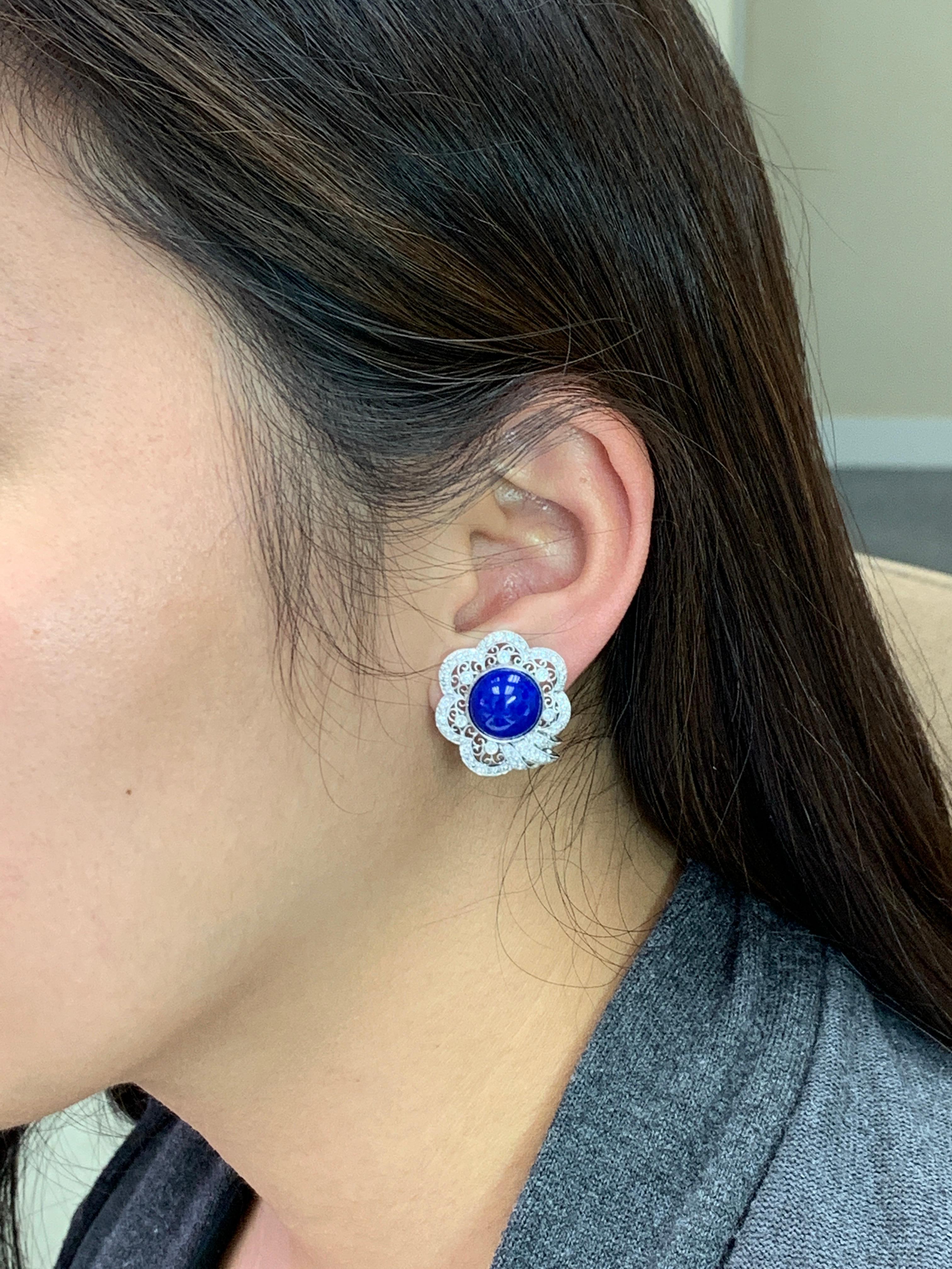 Please check out the HD video! Here is nice pair of earrings made with deep royal blue Lapis and diamonds. Lapis cabs are around 11.5mm each in diameter. There are about 1.24Cts of diamonds. The earrings are set in 18k white gold. The blue Lapis has
