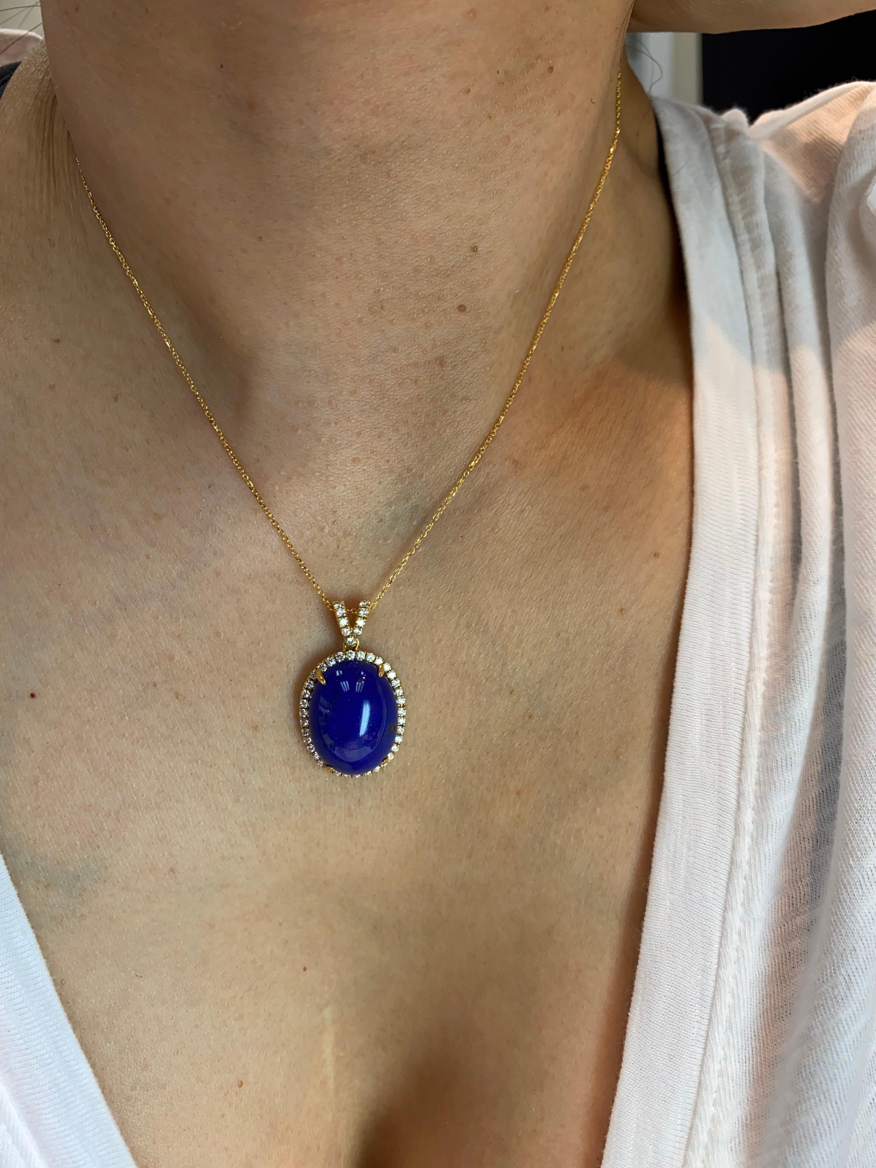 Here is nice diamond pendant made with deep royal blue Lapis. Old material. This Lapis cabs are large at around 20x15mm in diameter. The pendant are set in 18k yellow gold. Diamonds also surrounds the deep blue Lapis. There are 0.54 Cts of diamonds