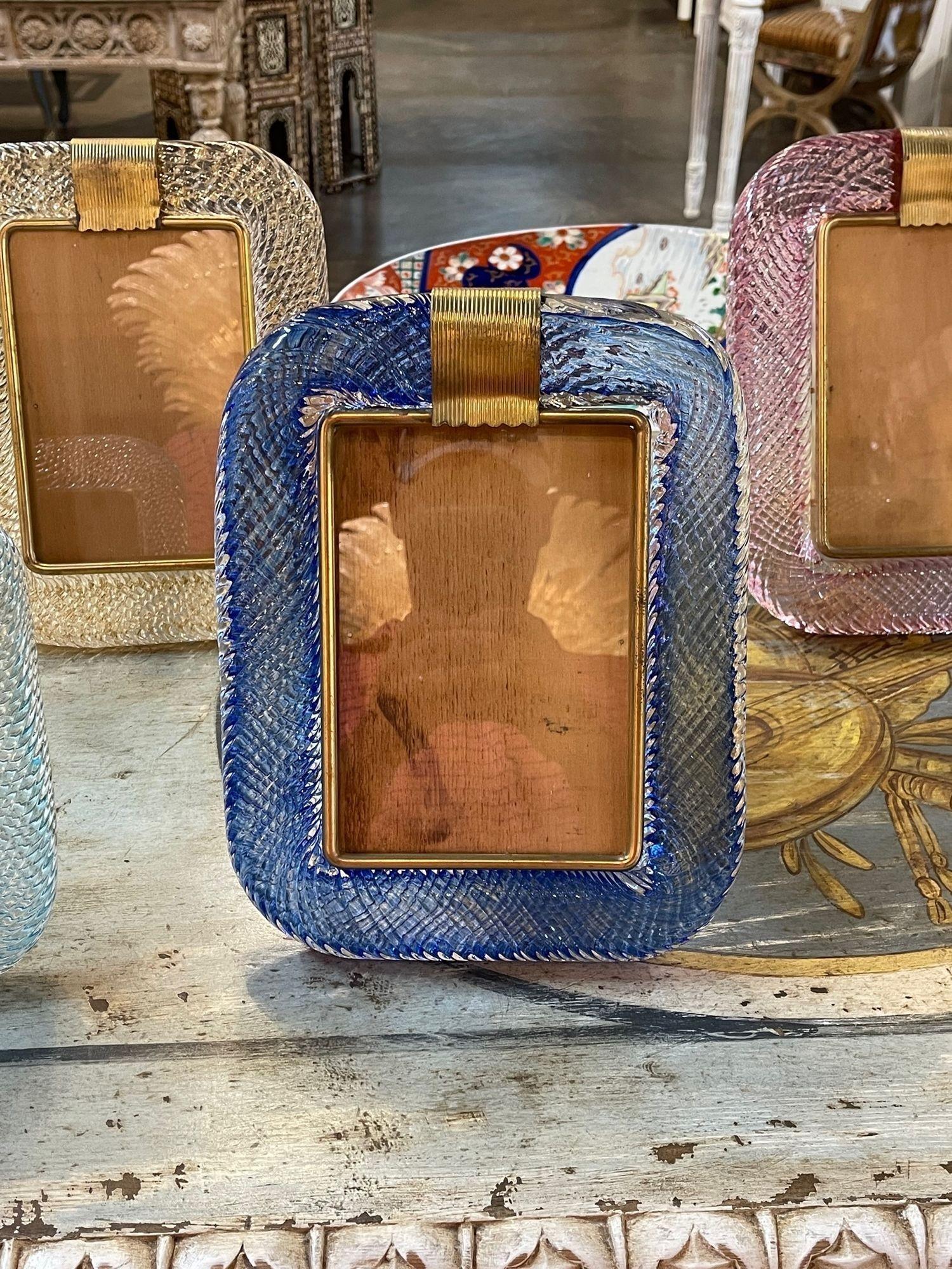 Decorative royal blue Murano glass picture frame. Featuring beautiful textured glistening glass. Also available in other colors as you can see in the pictures. Makes a fabulous accessory or special gift!.
