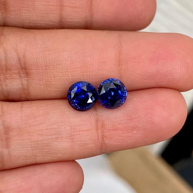 A rare find of royal blue sapphire pair in round shape, each near 2 carat in weight. Each sapphire has been certified to confirm its natural origin together with heat enhancement, a permanent enhancement to improve colour and clarity. This round