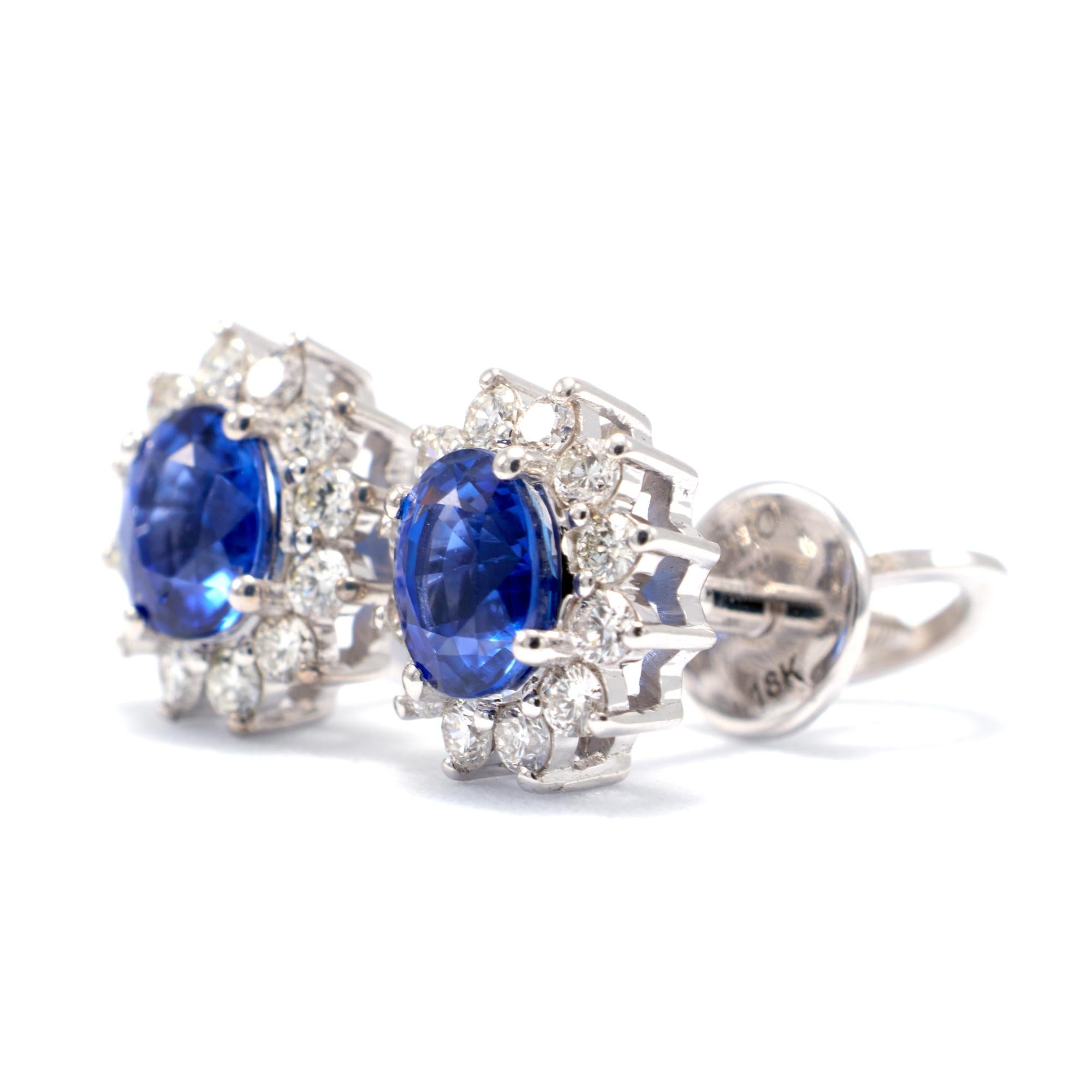 18k White Gold and Oval Cut Natural Royal Blue Sapphire surrounded by a halo of natural diamonds in a prong and basket setting

These regal blue sapphire and diamond stud earrings are fit for a queen. The deep blue sapphires are surrounded by a halo