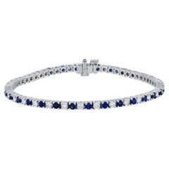 Bracciale da tennis in oro bianco con zaffiro blu reale e diamanti