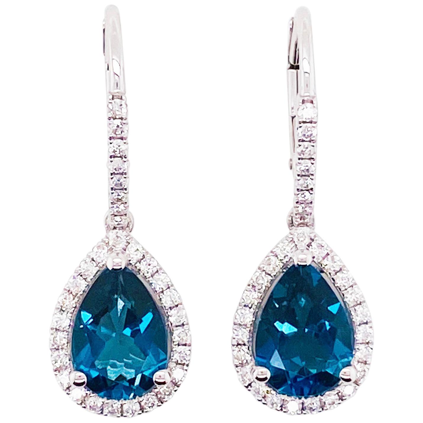 Royal Blue Topaz and Diamond Dangle Earrings in 14 Karat White Gold