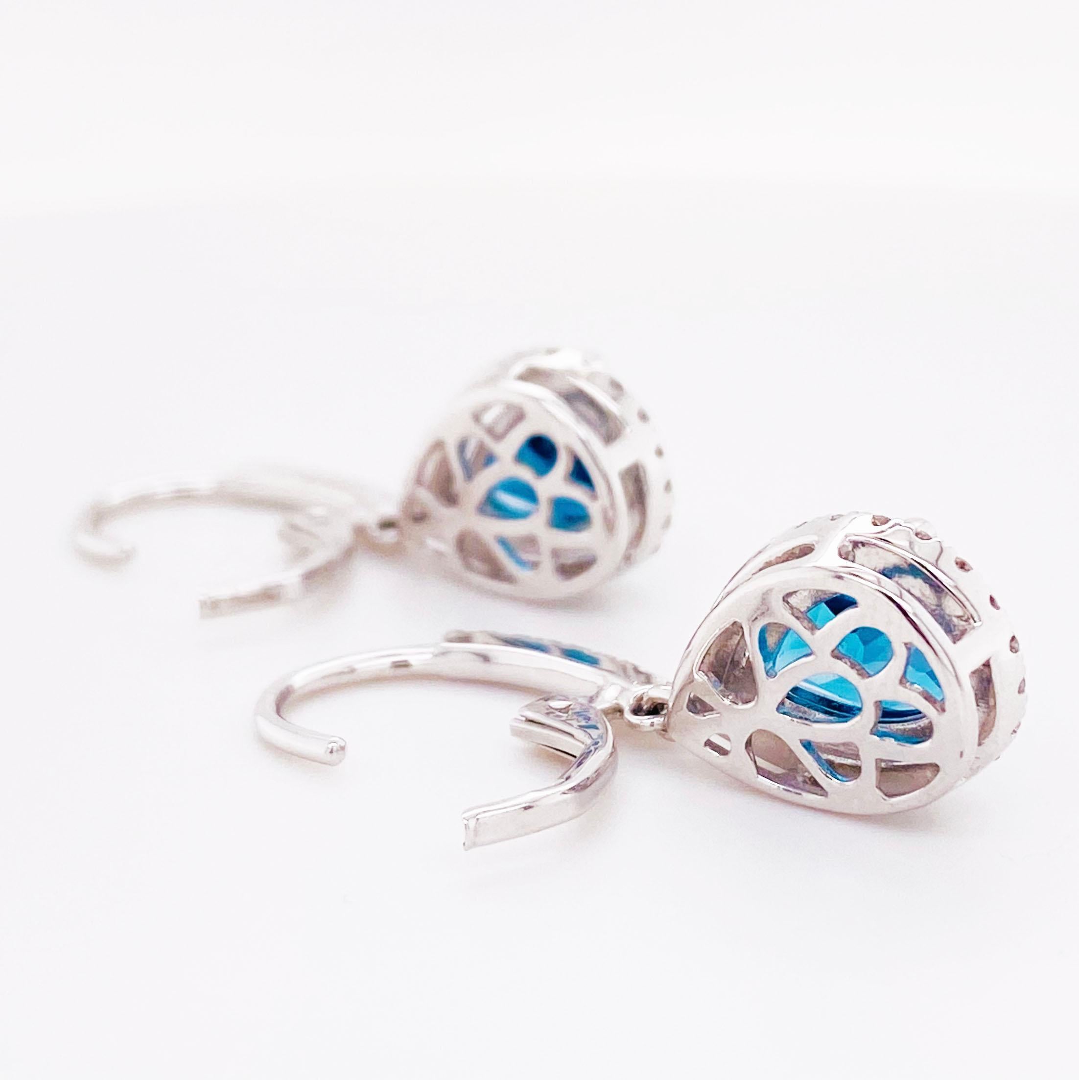 Contemporary Royal Blue Topaz and Diamond Dangle Earrings in 14 Karat White Gold