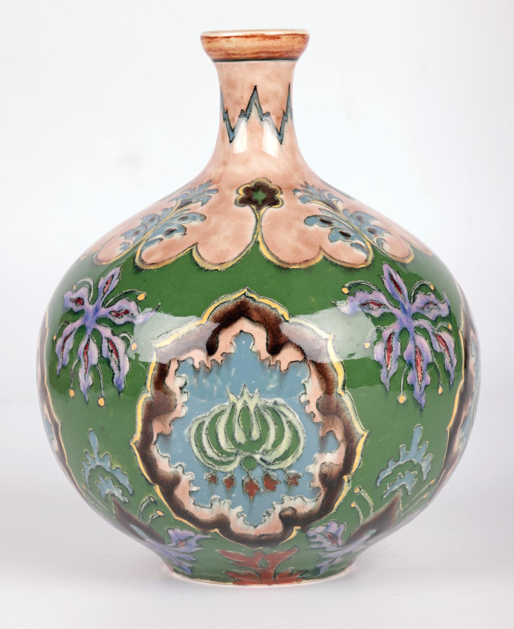 A fine and stunning Art Nouveau German pair of hand painted art pottery vases with floral designs made by the renowned manufactory of Royal Bonn and dating from around 1900. 
Royal Bonn ceramics was founded in 1836 by Franz Anton Mehlem and produced