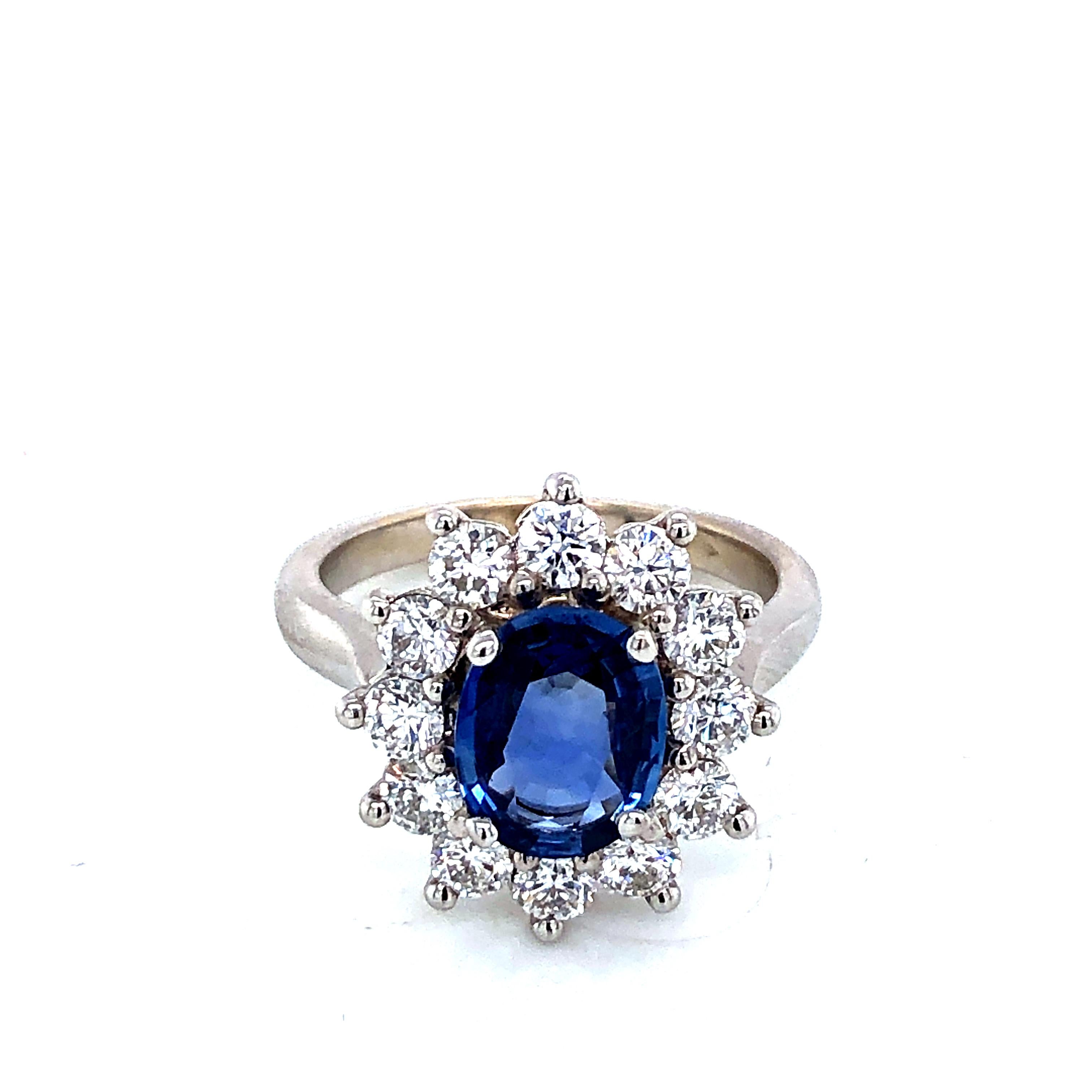 Discover this Royal Ceylon Sapphire and White Diamonds on White Gold Engagement Ring.
Ceylon Sapphire 1,8 Carat Size 9/7 oval shape
12 Diamonds 1,2 Carat Brillant shape 
White Gold 18 Carat 
French Size 54 
US Size 6 1/2
British Size N
Resizing