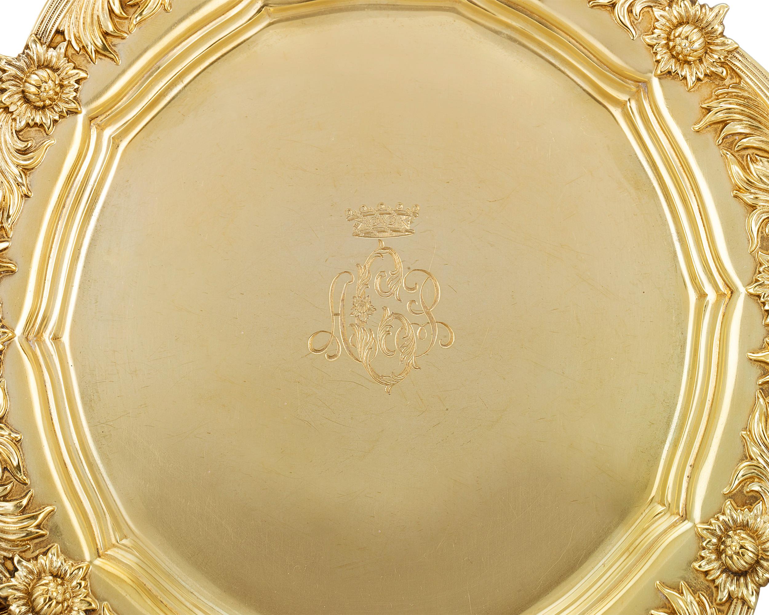 This exceptionally rare set of 8 silver gilt salad plates by Tiffany & Co. is crafted in the renowned firm’s Chrysanthemum pattern. Each plate is skillfully chased with blooms of chrysanthemum flowers, which encircle the plates' scalloped edges. The