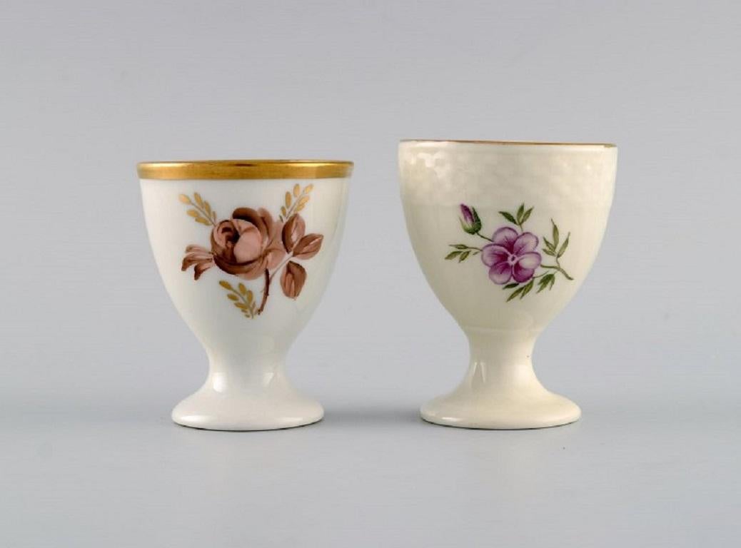 Royal Copenhagen and Bing & Grøndahl. Five egg cups in hand-painted porcelain. 1920s / 30s.
Largest measures: 6.7 x 5.2 cm.
In excellent condition.
Stamped.
1st factory quality.