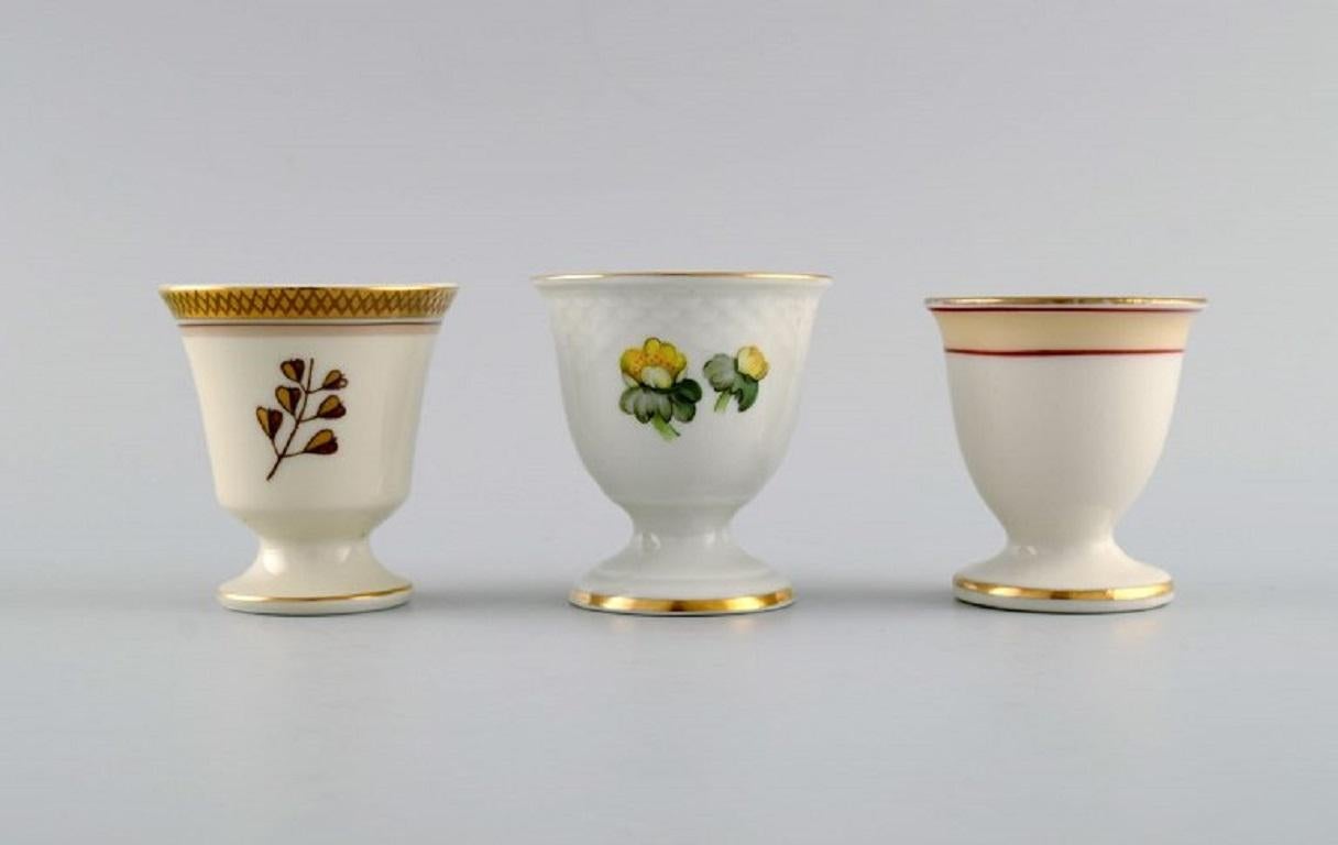Danish Royal Copenhagen and Bing & Grøndahl. Five egg cups in hand-painted porcelain. For Sale