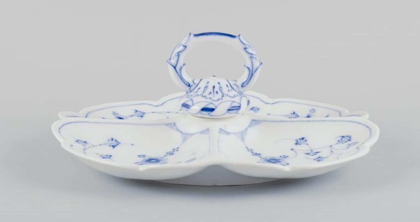 Royal Copenhagen, antique Blue Fluted cabaret tray with handle, divided into four compartments. 
Early and rare.
The first half of the 19th century.
In good condition.
Marked.
First factory quality.
Dimensions: Diameter 29.2 cm x Height 11.0 cm