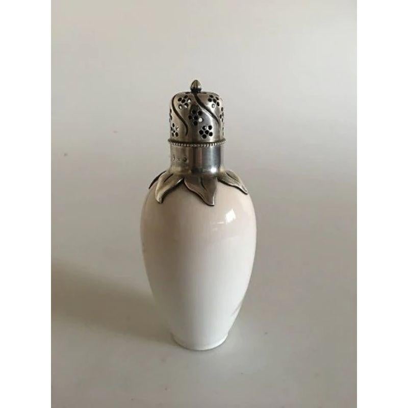 Royal Copenhagen Art Nouveau Anton Michelsen Silver Mounted Sugar Shaker No 299/47A with Butterfly motif

Measures 15cm / 6