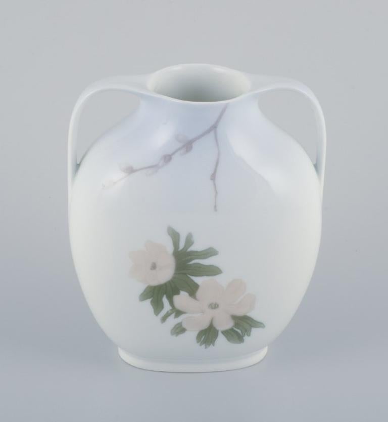 Royal Copenhagen, Art Nouveau porcelain vase with handles.
Early 1900s.
Model: 424/227.
Perfect condition.
First factory quality.
Dimensions: Width 15.0 cm x Height 17.0 cm.