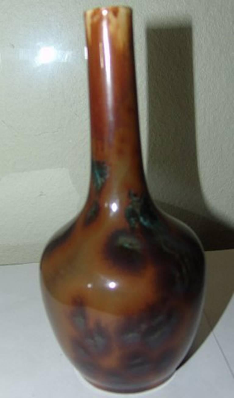 Royal Copenhagen Art Nouveau unique Ludvigsen crystalline glaze vase #988. Measures 19 cm and is in perfect condition. Beautiful with rarely seen brown crystals and with small blue crystals in the brown running glaze.