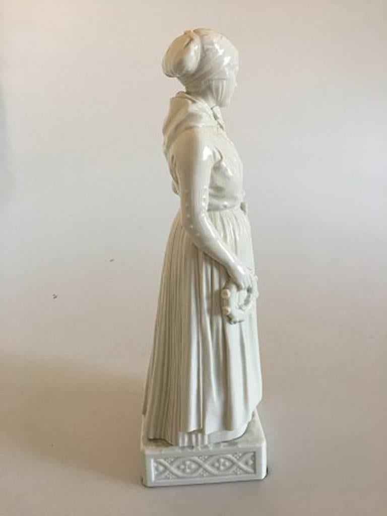 Royal Copenhagen blanc de chine figurine of Refsnæs woman. Measure: 31 cm tall (12 13/64 in). 2nd quality. In nice and whole condition.