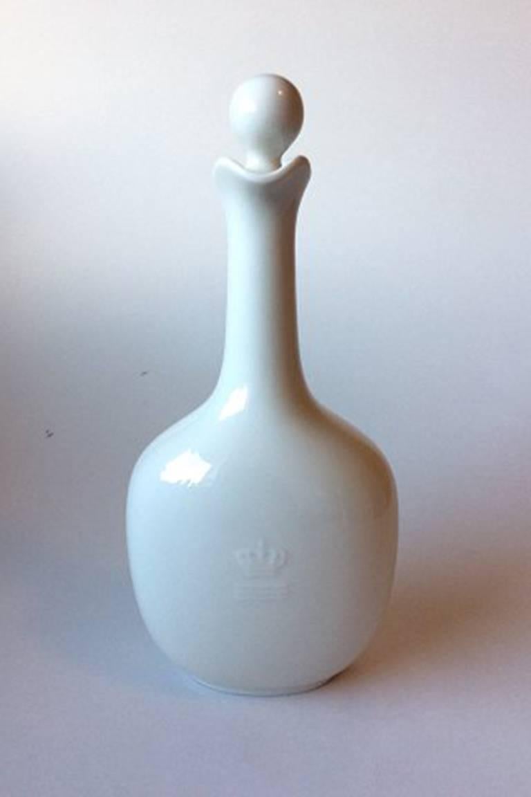 Royal Copenhagen blanc de chine flask with top no. 4494.

Measures 27 cm / 10 3/5 inches.