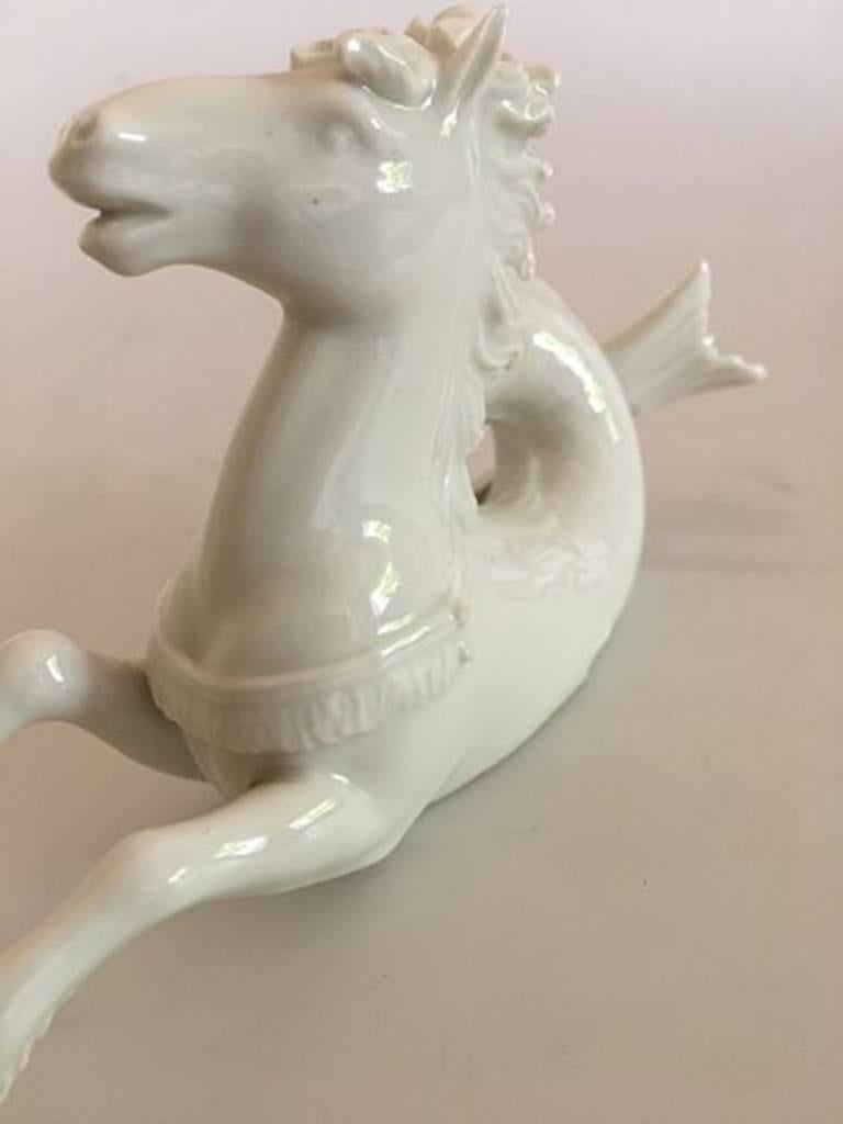 Royal Copenhagen blanc de chine merhorse decorative table figurine. Has a chip on the ring on the harness, otherwise in good condition, measure: 19 cm L, 9 cm H.