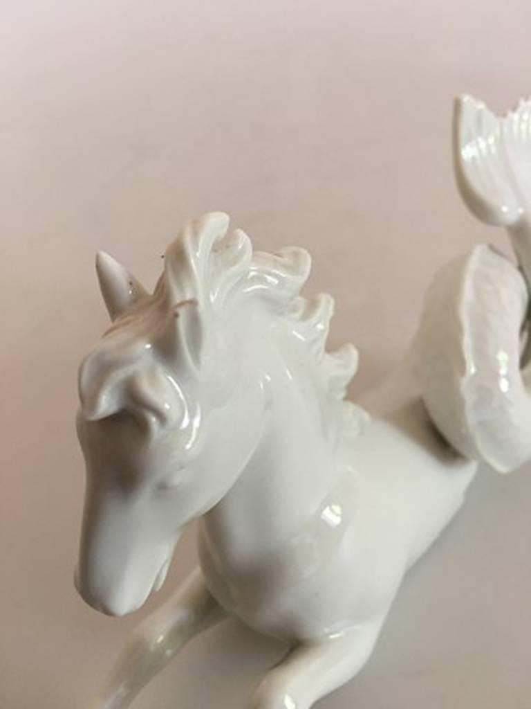Royal Copenhagen blanc de chine merhorse decorative table figurine. One of the ears is chipped otherwise in good condition. Measure: 19 cm L, 9 cm H.