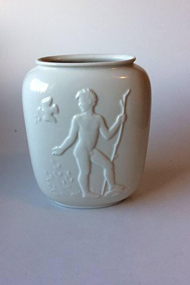 Royal Copenhagen blanc de chine vase with nude young man and woman no. 4117.

Measures: 23 cm / 9 1/20 inches.