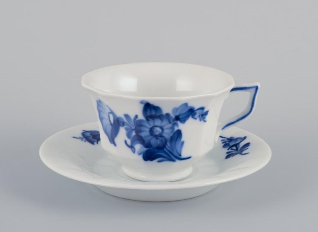 Royal Copenhagen Blue Flower Angular. 
A set of eight coffee cups with saucers.
Model 10/8608.
Dating for cups: Approx. 1950s.
Dating for saucers: 1937-1991.
First factory quality. One cup is second factory quality.
Perfect condition.
Marked.
Cup: D