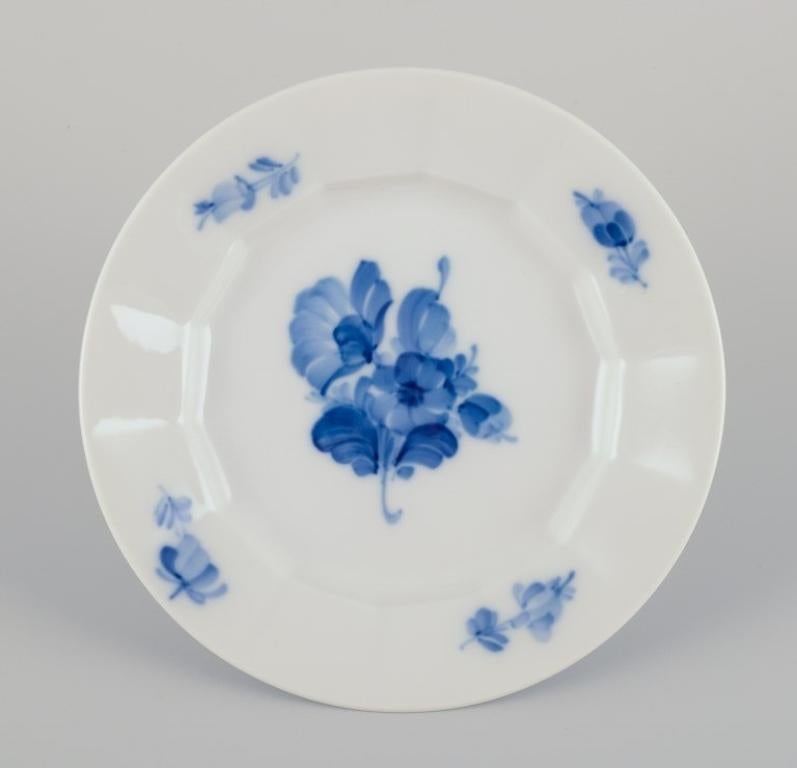 Royal Copenhagen Blue Flower Angular. Three plates and one bowl. 
Hand-painted porcelain.
1930s.
Model 10/8557 and 10/8553.
Bowl in second factory quality.
Plates in first factory quality.
In excellent condition. Bowl with a tiny chip on the inside