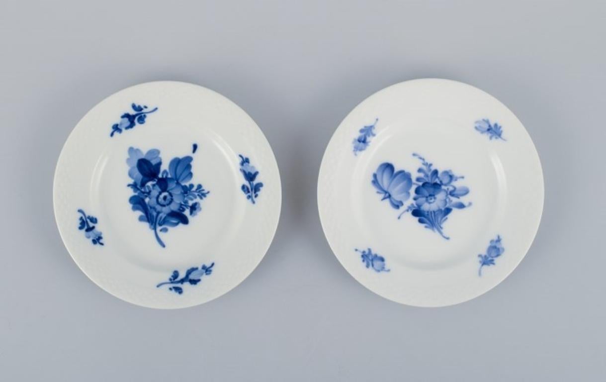 Hand-Painted Royal Copenhagen Blue Flower Braided, set of eight plates.