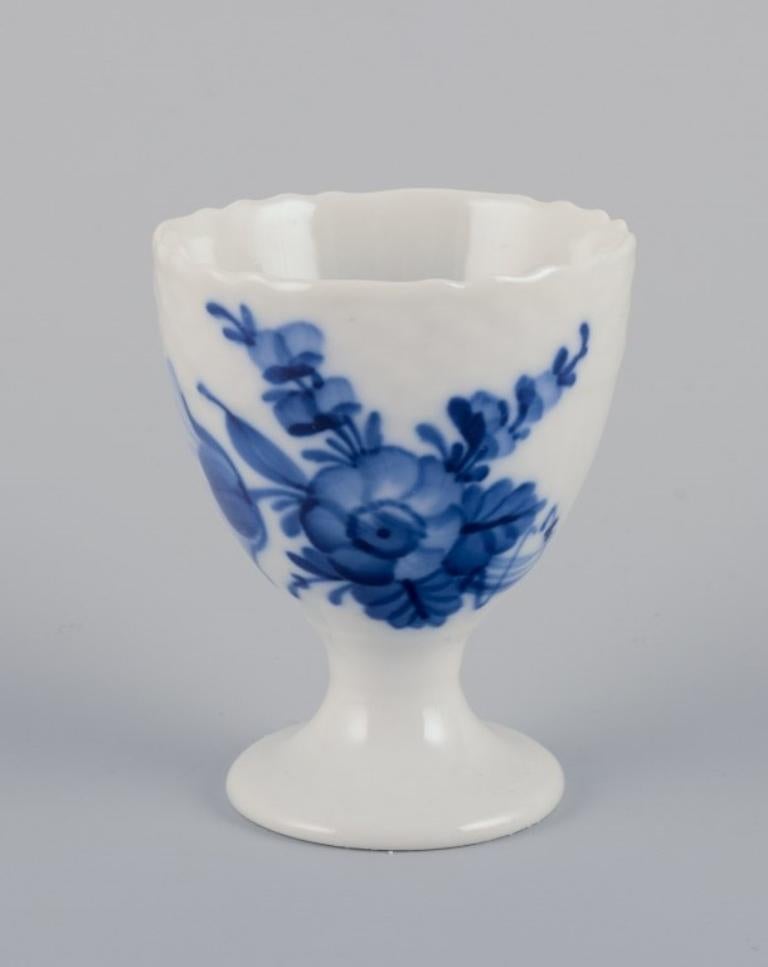 Royal Copenhagen Blue Flower Braided. 
Six pieces including a candlestick, egg cup, pepper shaker, salt shaker, and two butter dishes.
Various dating.
First factory quality. Egg cup is second factory quality.
Perfect condition.
Marked.
Candlestick: