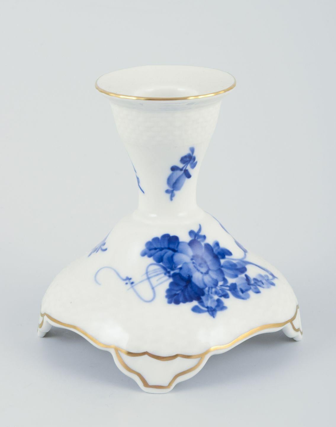 PRE-OWNED GOODS ARE EXEMPT FROM IMPORT TARIFFS FOR U.S., UK, AUSTRALIAN & CANADIAN CUSTOMERS.   
THEREFORE, NO IMPORT TARIFFS WILL BE APPLICABLE TO YOUR PURCHASE. 

Royal Copenhagen Blue Flower Curved, a pair of low candlesticks.
Hand-painted in