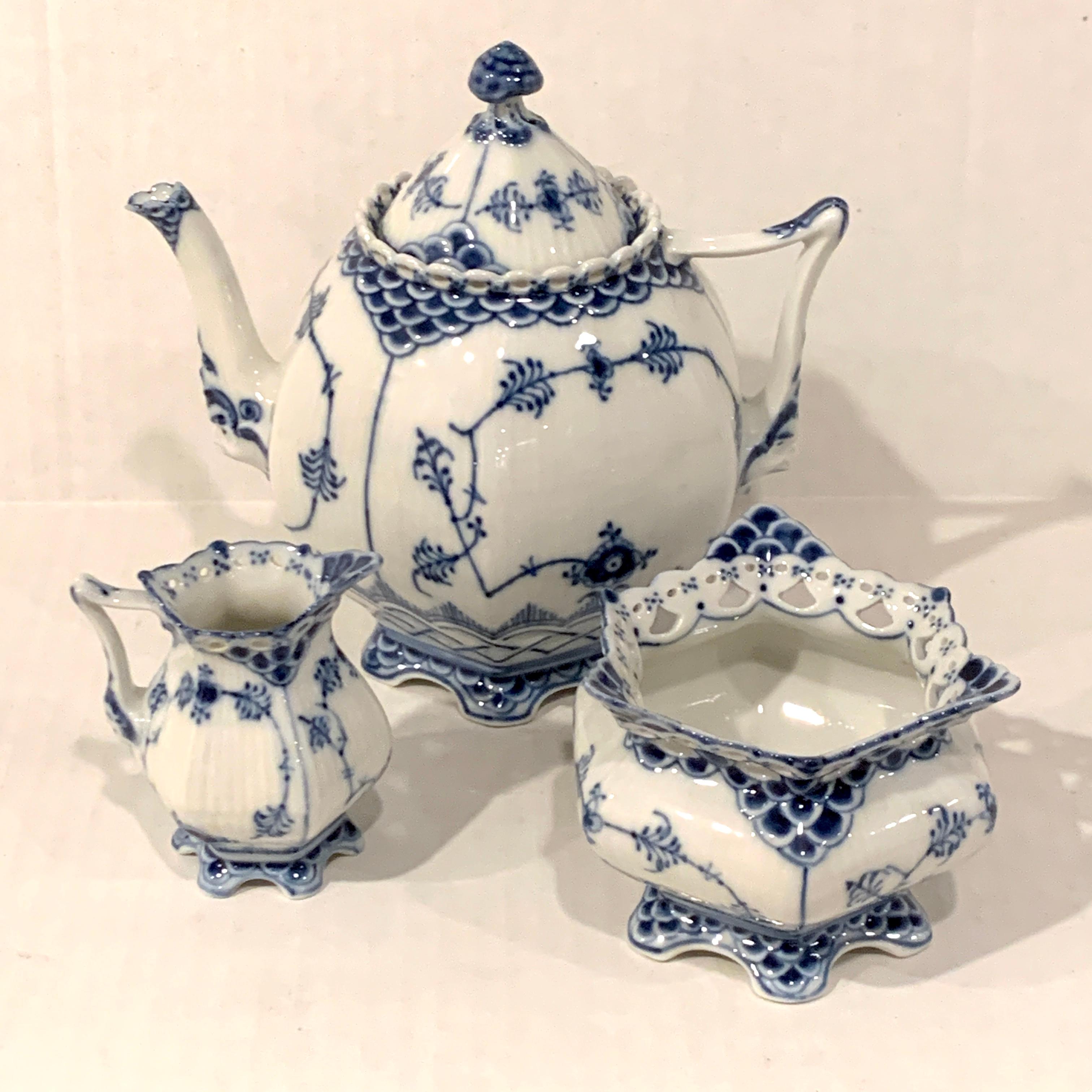 Royal Copenhagen Blue Fluted Full Lace Tea Set, Consisting of three pieces all in well cared for vintage condition, no chips, cracks or repairs 
Tea pot 5