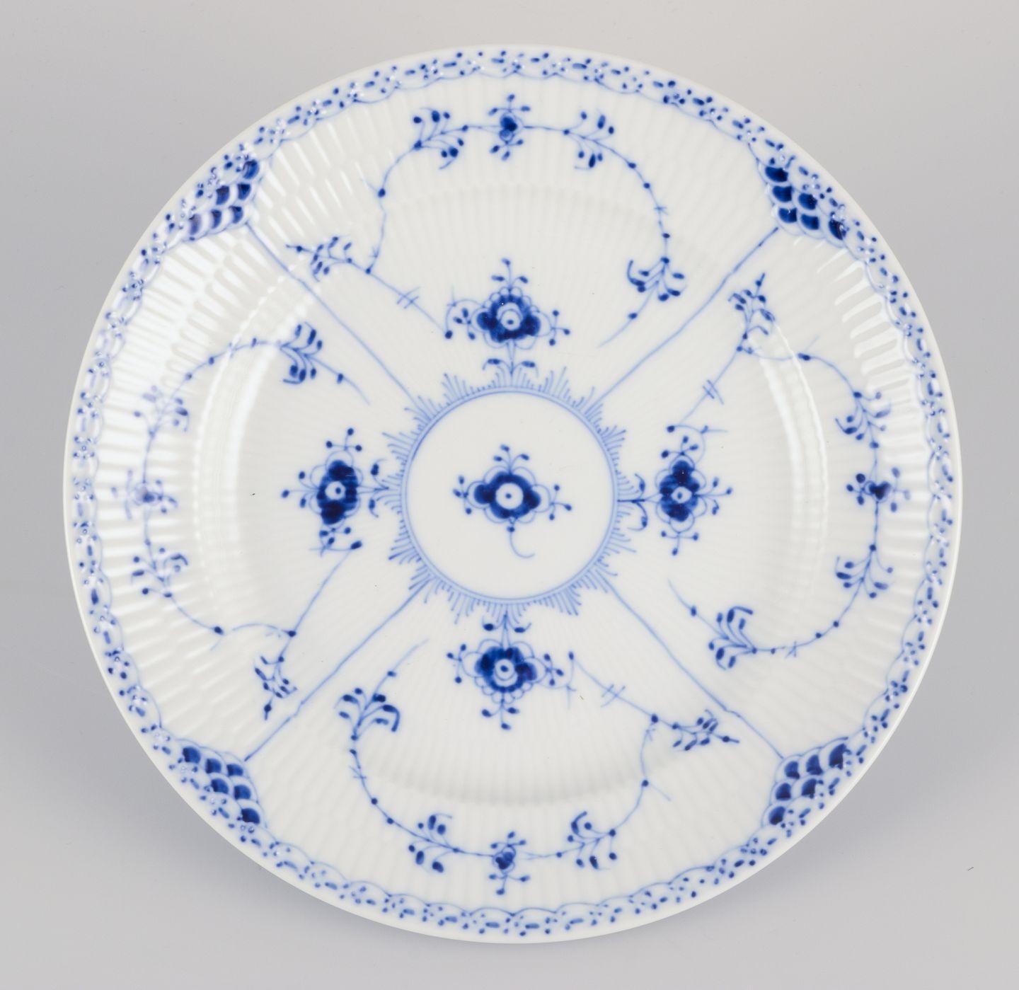 Pre-owned goods are exempt from import duties for U.S. customers. 
Therefore, no import tariffs will be applicable to your purchase.

Royal Copenhagen, Blue Fluted Half Lace, a set of five lunch plates.
Model: 1/572.
Dating: 1969-1974 one