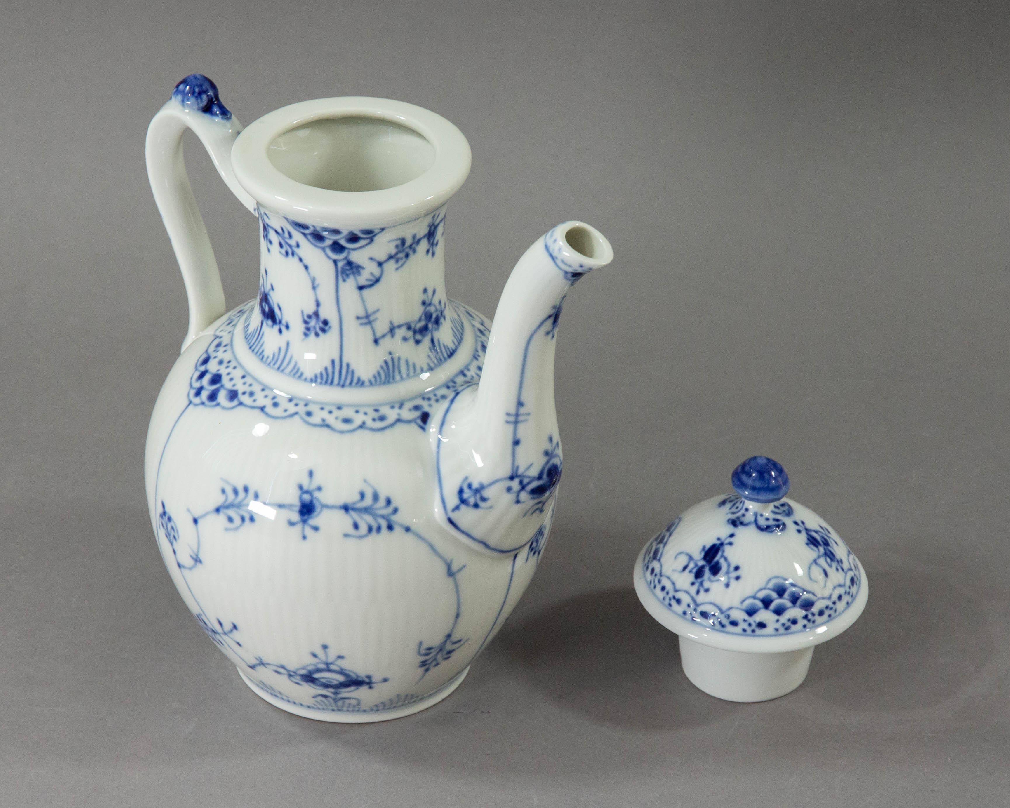 A beautiful coffee pot made by Royal Copenhagen in Denmark decorated with the blue fluted pattern in half lace.

The Blue Fluted pattern, also known as Musselmalet was the first pattern Royal Copenhagen produced. It was first made in 1775. The