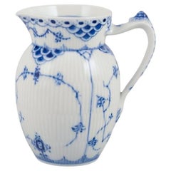 Royal Copenhagen Blue Fluted Half Lace, milk jug. Handle shaped like a snail.
