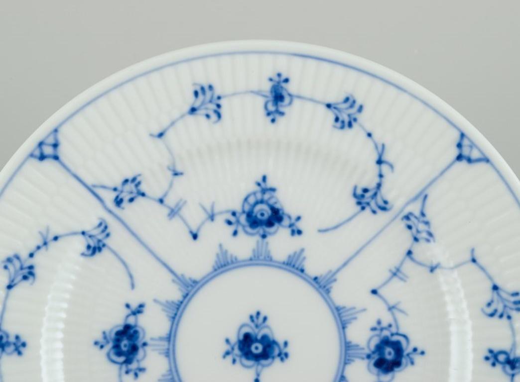 Hand-Painted Royal Copenhagen Blue Fluted Plain. Eight plates in porcelain.