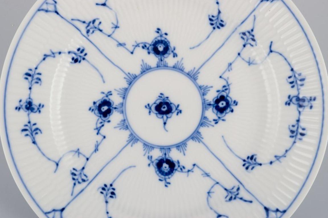 Royal Copenhagen Blau geriffelte Plain. Vier Teller aus Porzellan. (Dänisch)