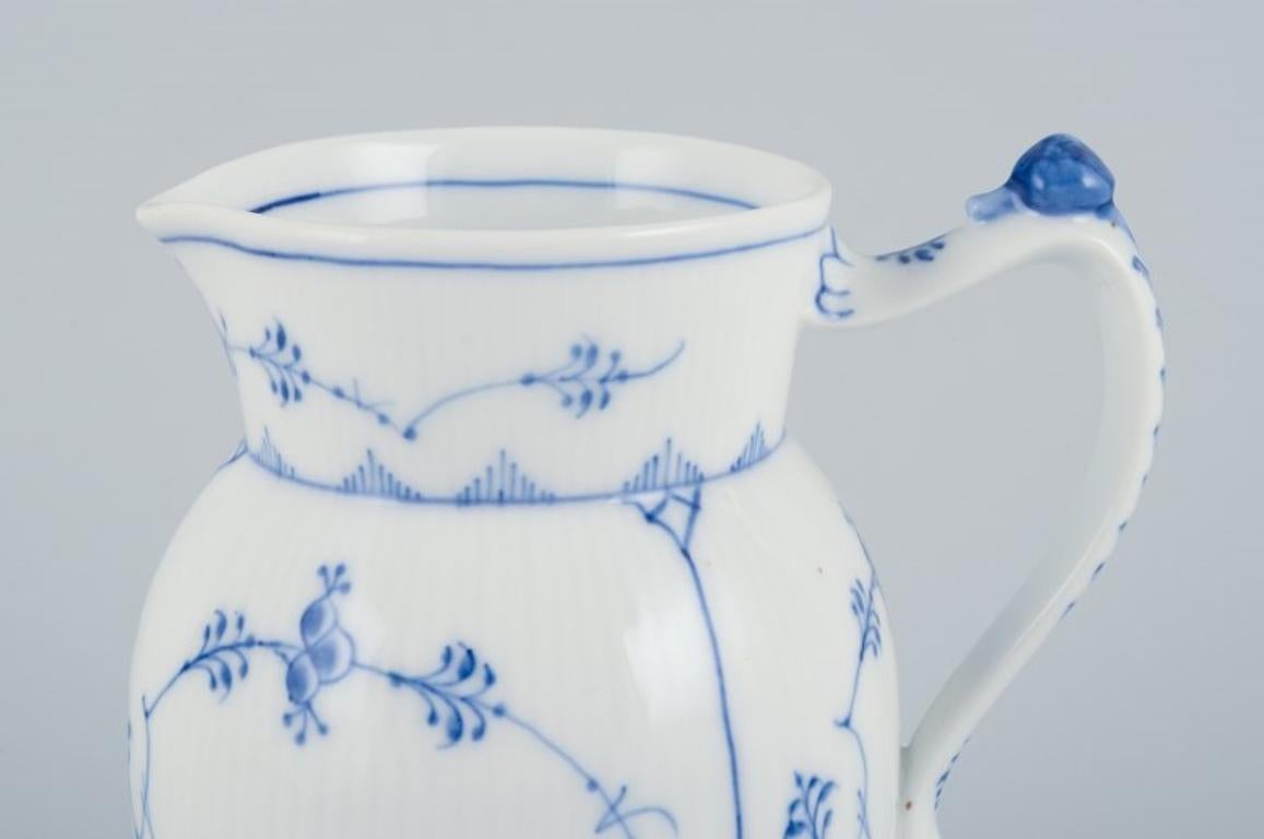 Hand-Painted Royal Copenhagen, Blue Fluted Plain, jug. With small snail on top of handle.  For Sale