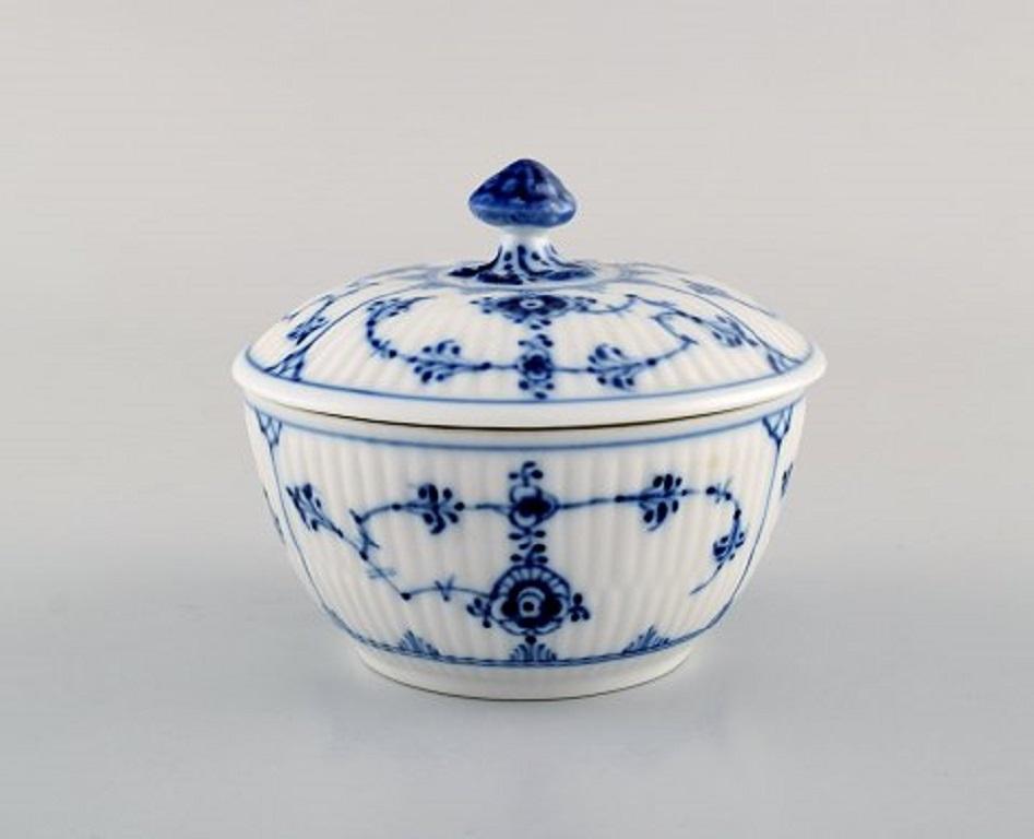 Royal Copenhagen blue fluted plain lidded sugar bowl # 1/239.
Measures: 9.5 x 7.5 cm.
In perfect condition.
1st factory quality.
Stamped.