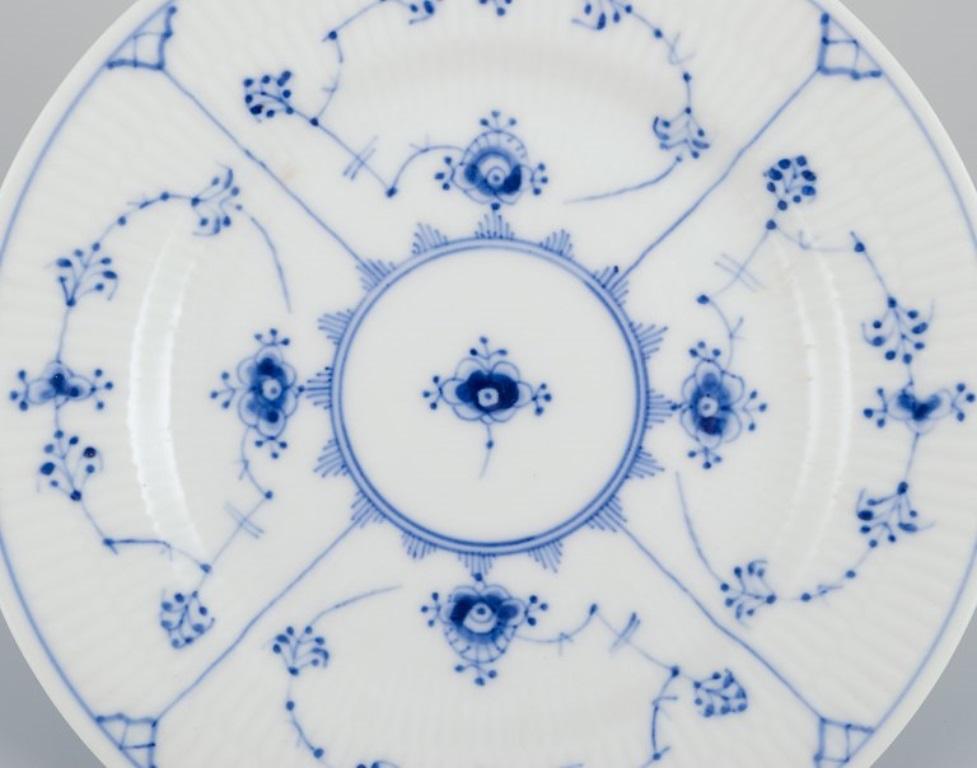 Royal Copenhagen Blau geriffelte Plain. Neun Teller aus Porzellan. (Dänisch)