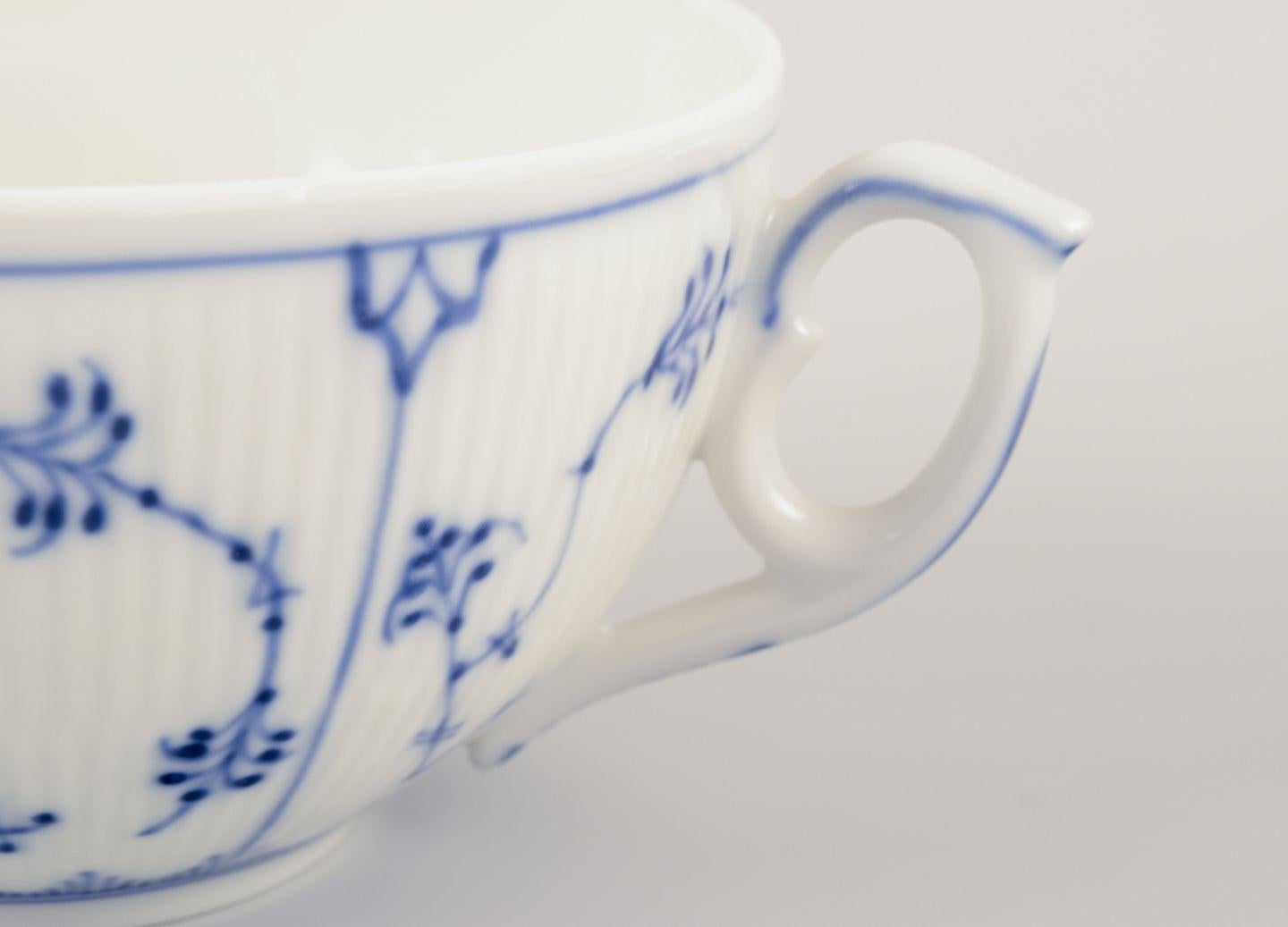 Hand-Painted Royal Copenhagen Blue Fluted Plain. Set of four bouillon cups with saucers For Sale