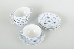 Royal Copenhagen Blue Fluted Plain. Set of four tea cups with matching saucers.