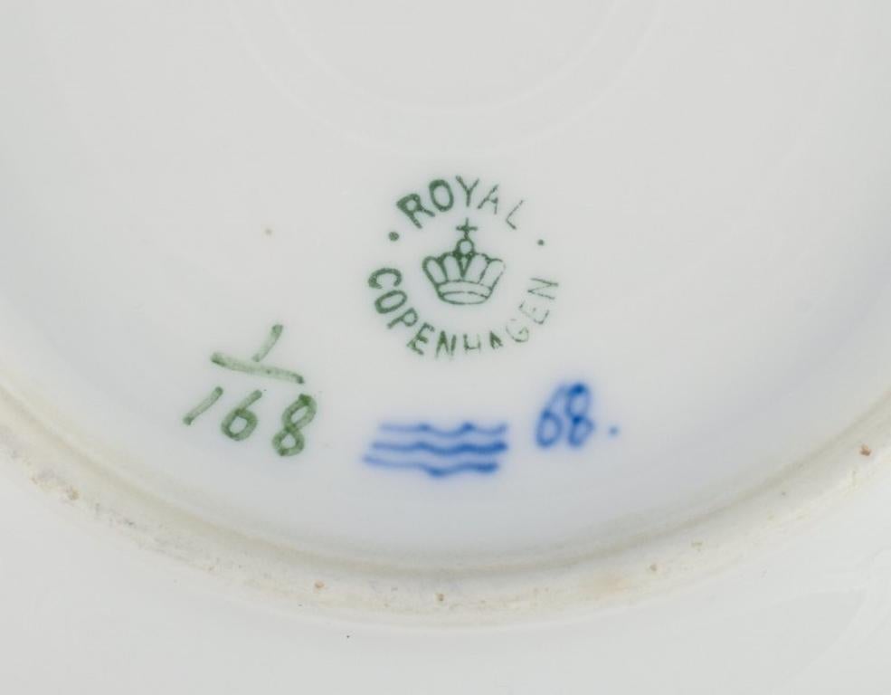 20th Century Royal Copenhagen Blue Fluted Plain, two deep porcelain plates. Early 20th C.