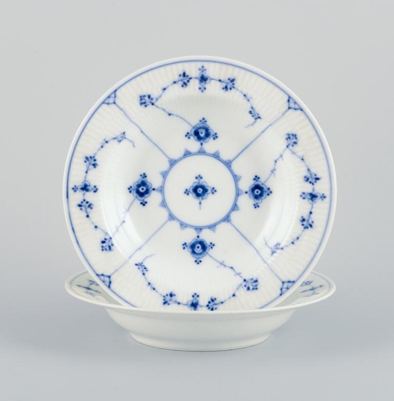 Royal Copenhagen Blue Fluted Plain, two deep porcelain plates. Early 20th C.