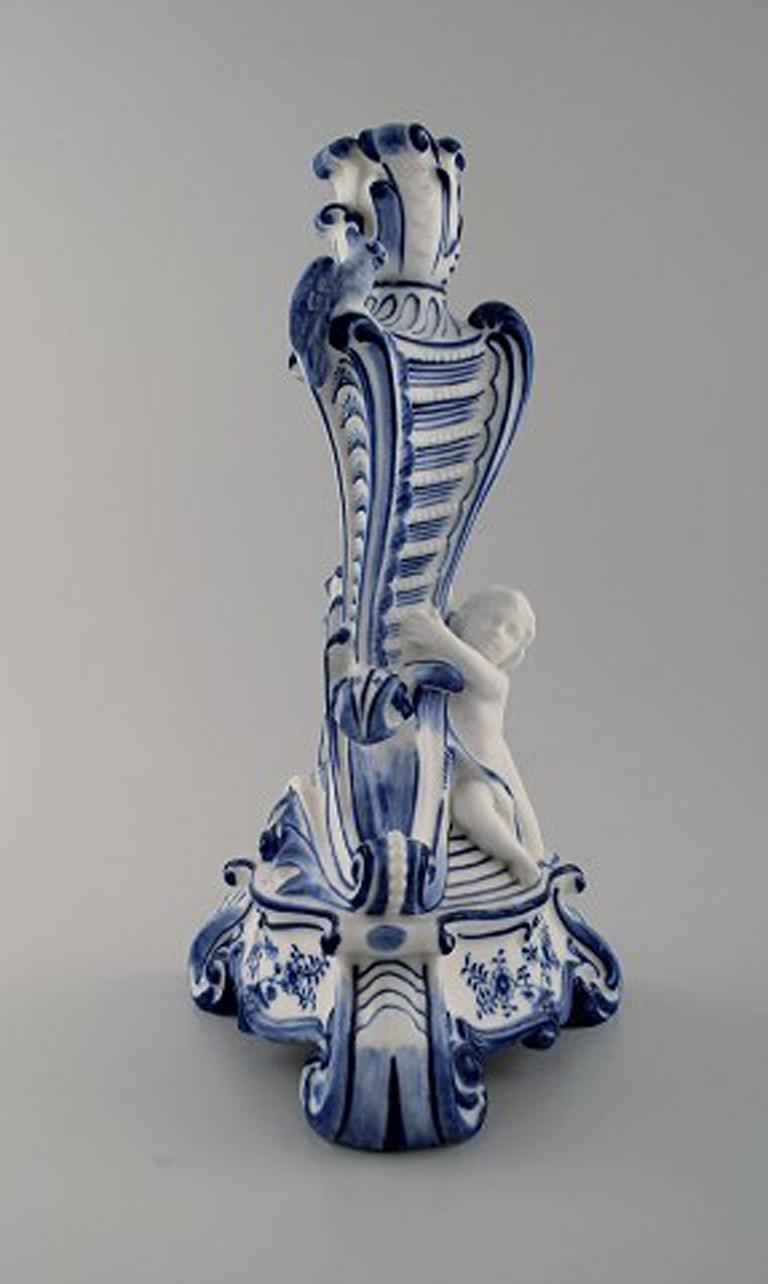 Royal Copenhagen. Candlestick of porcelain, Blue fluted no. 1/13 with bird and fawn sitting on tripod base.
1st. factory quality.
In perfect condition.
Measures: 32 cm. x 17 cm.