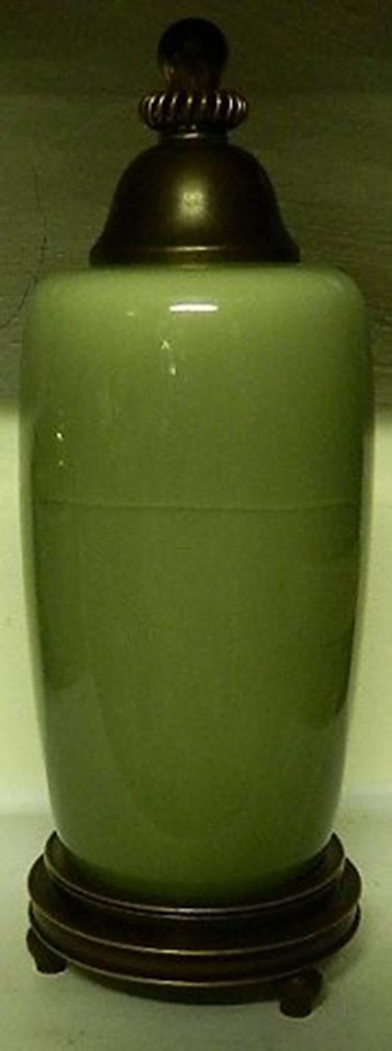 Royal Copenhagen Celedon vase with bronze stand and lid by Knud Andersen. The vase has cracks underneath the glaze, see pictures.