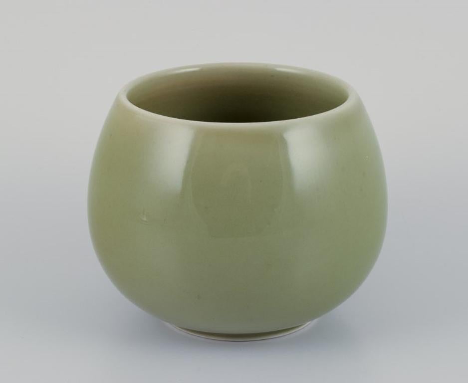 Danish Royal Copenhagen ceramic jar. Silver lid with ebony knob. Celadon glaze. For Sale